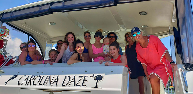 Guests on the stern of the Carolina Daze in Fort Myers Beach